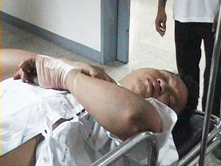 Somkiat Tamnai arrives at Banglamung Hospital for treatment after being attacked in the early hours of Friday, March 4.